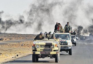 Войска Каддафи воюют с повстанцами за КПП на границе Ливии с Тунисом